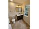Bathroom with dark wood vanity, white countertop, and tile flooring at 213 Meadow Wind Ct, Monroe, NC 28110