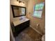 Bathroom with dark wood vanity, white countertop, and tile flooring at 213 Meadow Wind Ct, Monroe, NC 28110