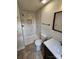 Updated bathroom featuring a modern shower with white marble tile and black fixtures, and vanity at 213 Meadow Wind Ct, Monroe, NC 28110