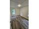 Bedroom with two windows allowing natural light with modern plank floors at 213 Meadow Wind Ct, Monroe, NC 28110
