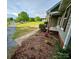 Well-manicured lawn and landscaping highlight the exterior view of this home at 213 Meadow Wind Ct, Monroe, NC 28110
