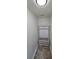Entryway with white hall tree bench featuring storage and hooks with beige tile floors at 213 Meadow Wind Ct, Monroe, NC 28110