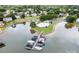 Aerial view of a lake community featuring a pool, boat docks, and scenic surroundings at 220 Chandeleur Dr, Mooresville, NC 28117