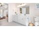 Spacious bathroom with double sinks, white cabinets, and a large mirror at 220 Chandeleur Dr, Mooresville, NC 28117