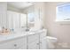 Bright bathroom with white cabinets, marble countertop, and decorative accents at 220 Chandeleur Dr, Mooresville, NC 28117