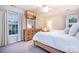This bedroom features a dresser with a TV, two windows, and a ceiling fan at 220 Chandeleur Dr, Mooresville, NC 28117