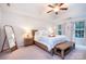 Serene bedroom with tray ceiling, wood furnishings, and cozy decor at 220 Chandeleur Dr, Mooresville, NC 28117