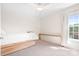 Minimalist bedroom featuring a bed with storage drawers and a bright window with a lake view at 220 Chandeleur Dr, Mooresville, NC 28117