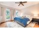 Comfortable bedroom with a queen bed, wood floors, and plenty of natural light at 220 Chandeleur Dr, Mooresville, NC 28117