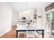 Bright eat-in kitchen with white cabinetry, stainless appliances, and a view to the backyard at 220 Chandeleur Dr, Mooresville, NC 28117