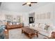 Inviting living room featuring hardwood floors, comfortable seating, decorative accents, and abundant natural light at 220 Chandeleur Dr, Mooresville, NC 28117