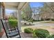 Relaxing front porch view with rocking chairs, manicured landscaping, and a quiet street view at 220 Chandeleur Dr, Mooresville, NC 28117