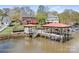 Stunning waterfront property with dock and multiple boat slips and lake views at 220 Chandeleur Dr, Mooresville, NC 28117