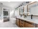 A spacious bathroom with a soaking tub, double vanity, and marble floors at 2200 Stratford Ave, Charlotte, NC 28205