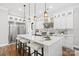 Bright kitchen featuring an island, stainless steel appliances and a white color scheme at 2200 Stratford Ave, Charlotte, NC 28205