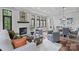 Elegant living room with fireplace, coffered ceilings, stylish furniture, and hardwood floors at 2200 Stratford Ave, Charlotte, NC 28205