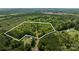 Aerial shot outlining the property lines of the land, showing the home surrounded by dense woodlands at 2275 Brown Creek Church Rd, Wadesboro, NC 28170
