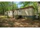 Scenic backyard with mature trees and ample space at 2275 Brown Creek Church Rd, Wadesboro, NC 28170
