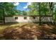 Exterior of house set among mature trees with grassy area at 2275 Brown Creek Church Rd, Wadesboro, NC 28170