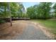 Spacious property with a gravel driveway and mature trees at 2275 Brown Creek Church Rd, Wadesboro, NC 28170