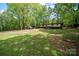 Large property featuring a well-maintained lawn and outbuildings at 2275 Brown Creek Church Rd, Wadesboro, NC 28170