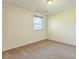 Bright bedroom features neutral walls, plush carpeting, and a window providing natural light at 266 Kelly St, Statesville, NC 28677