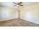 Neutral bedroom with carpeted floors and a ceiling fan offering a serene retreat at 266 Kelly St, Statesville, NC 28677