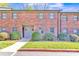 Charming brick townhouse with manicured lawn and inviting entrance at 266 Kelly St, Statesville, NC 28677