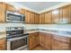 Well-appointed kitchen featuring wooden cabinets and stainless steel appliances at 266 Kelly St, Statesville, NC 28677