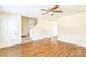 Inviting living room featuring hardwood floors, staircase, and a ceiling fan, creating a cozy and stylish atmosphere at 266 Kelly St, Statesville, NC 28677
