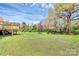 Lush backyard with a large wooden deck, perfect for enjoying the outdoors and recreation at 2703 Plantation Way, Albemarle, NC 28001