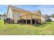 Spacious backyard featuring a large wooden deck, perfect for outdoor entertaining and relaxation at 2703 Plantation Way, Albemarle, NC 28001