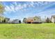 Sprawling backyard featuring a well-maintained lawn and wooden deck, ideal for outdoor activities at 2703 Plantation Way, Albemarle, NC 28001