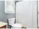 Cozy bathroom with a standard toilet, shower, and window at 2703 Plantation Way, Albemarle, NC 28001