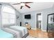 Bedroom featuring a TV, large window, and comfortable bedding at 2703 Plantation Way, Albemarle, NC 28001