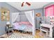 Whimsical bedroom with a canopy bed, bright decor, and a cozy feel at 2703 Plantation Way, Albemarle, NC 28001