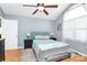 Bedroom with a large window, comfortable bed, and hardwood floors at 2703 Plantation Way, Albemarle, NC 28001