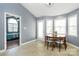 Dining area leads to bedroom and features a round table and tile flooring at 2703 Plantation Way, Albemarle, NC 28001