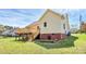 Exterior view of the home featuring a wooden deck, perfect for enjoying the outdoors at 2703 Plantation Way, Albemarle, NC 28001