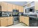 Functional kitchen with stainless steel appliances and ample cabinet space at 2703 Plantation Way, Albemarle, NC 28001