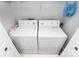 Compact laundry area equipped with a standard washer and dryer set, maximizing utility at 2703 Plantation Way, Albemarle, NC 28001