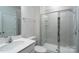 A modern bathroom with glass shower, sink, and toilet at 2932 Pirates Pl, Charlotte, NC 28216