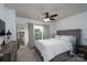 Bright bedroom featuring a plush bed, ceiling fan, and natural light from the window at 2932 Pirates Pl, Charlotte, NC 28216