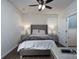Cozy bedroom with dark floors and ceiling fan at 2932 Pirates Pl, Charlotte, NC 28216