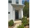Close-up of the front door with sidelights, landscaping, and house number at 2932 Pirates Pl, Charlotte, NC 28216