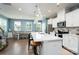 Open concept kitchen with a quartz countertop island, stainless steel appliances, and a dining area at 2932 Pirates Pl, Charlotte, NC 28216