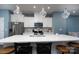 Open concept kitchen with a quartz countertop island, stainless steel appliances, and stylish pendant lights at 2932 Pirates Pl, Charlotte, NC 28216