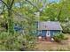 Aerial view of the backyard with lush greenery, a well-maintained lawn, and mature trees providing ample privacy at 3005 Kenninghall Ct, Charlotte, NC 28269