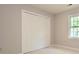 Bedroom with closet and window with carpeted floor at 3005 Kenninghall Ct, Charlotte, NC 28269