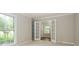 Inviting bedroom with natural light, complemented by double French doors at 3005 Kenninghall Ct, Charlotte, NC 28269